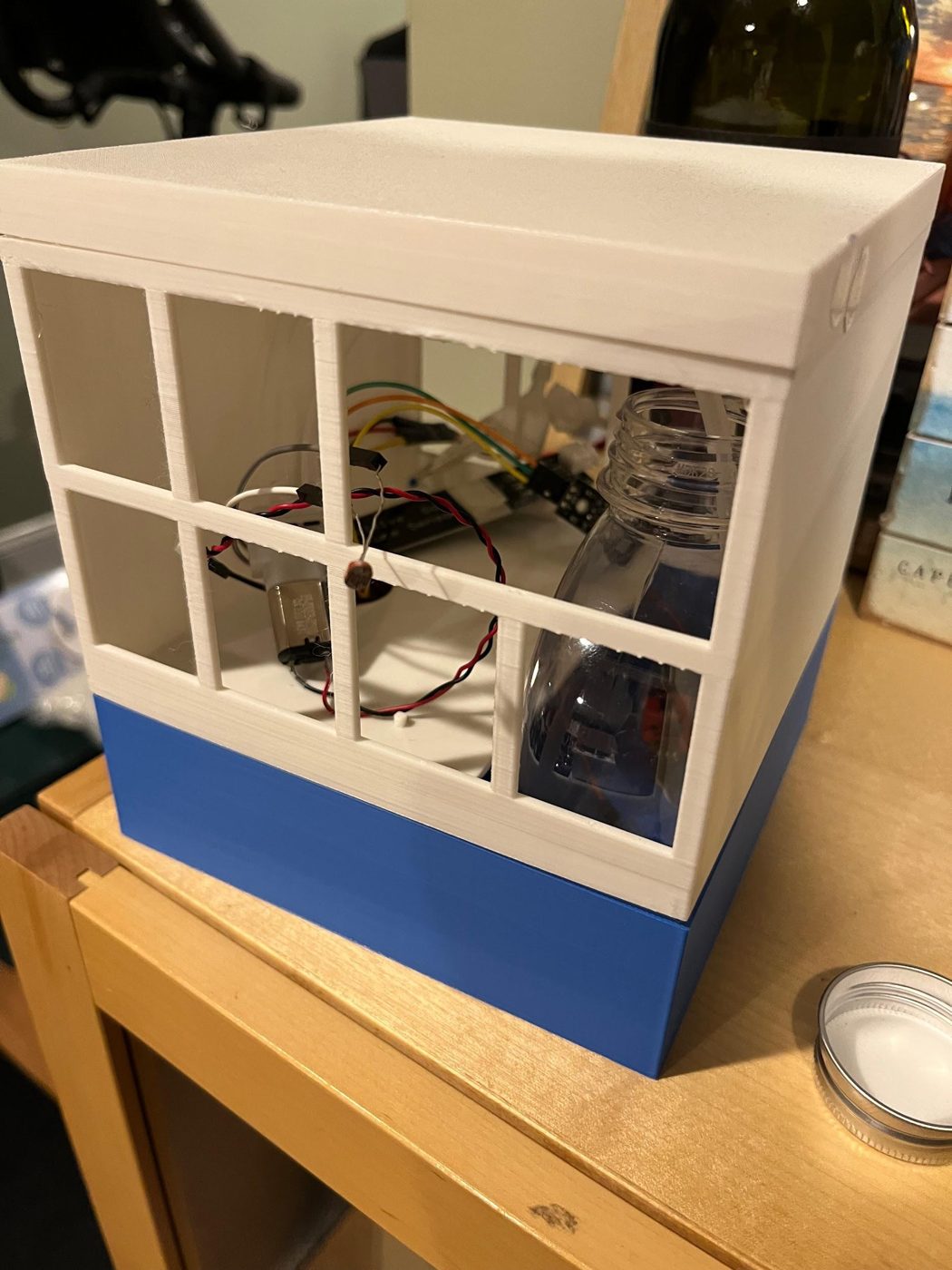 Finished plant watering enclosure